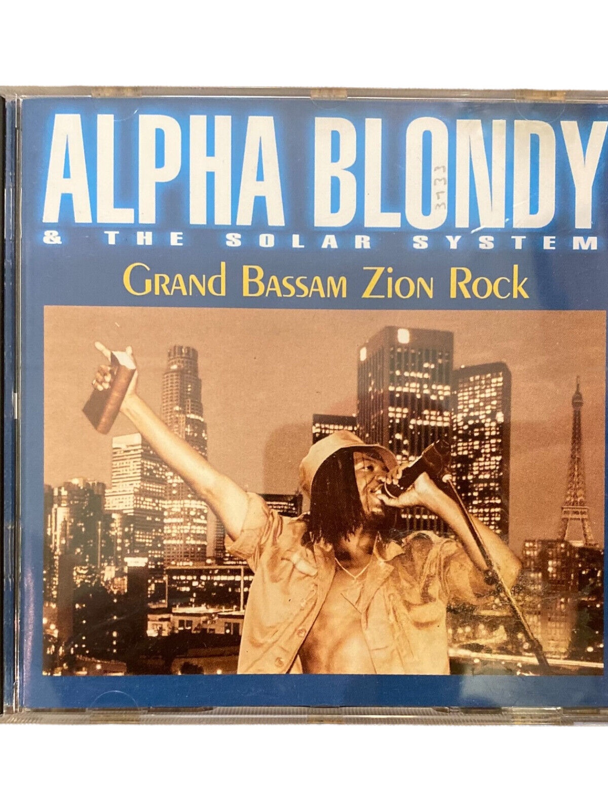 3133 Alpha Blondy ALPHA BLONDY & THE SOLAR SYSTEM: GRAND BASSAM ZION ROCK HC